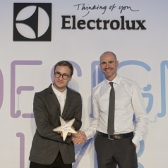 Winner of the Electrolux Design Lab 2012 competition Jan Ankiersztajn from Poland congratulated by Thomas Johansson, Design Director of Electrolux.