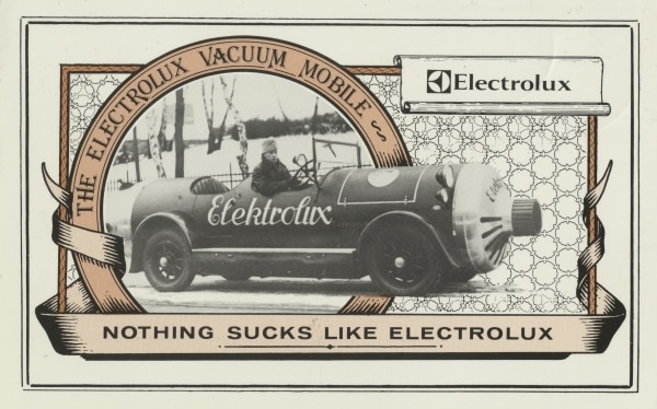 A post card with the Brittish tag line from the 1980s, "Nothing sucks like Electrolux". The image on the post card is an older one from 1927.