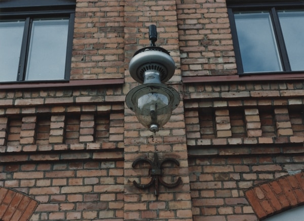 The Lux lamp mounted on a facade at the Electrolux factory on Lilla Essingen
