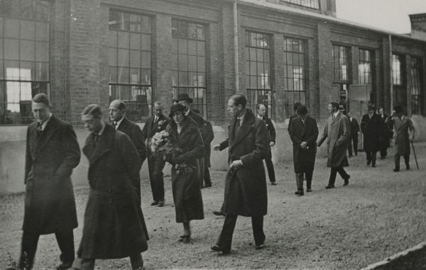 The Prince of Wales (2nd on left) visits the factory on Lilla Essingen. Carrying the flower bouqet is Crown Princess Louise of Sweden