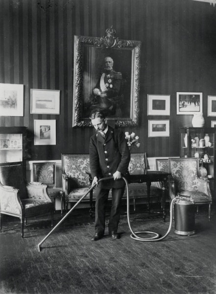 The vacuum cleaner Lux Model I shown here in use at the Stockholm Castle in the early 1900's