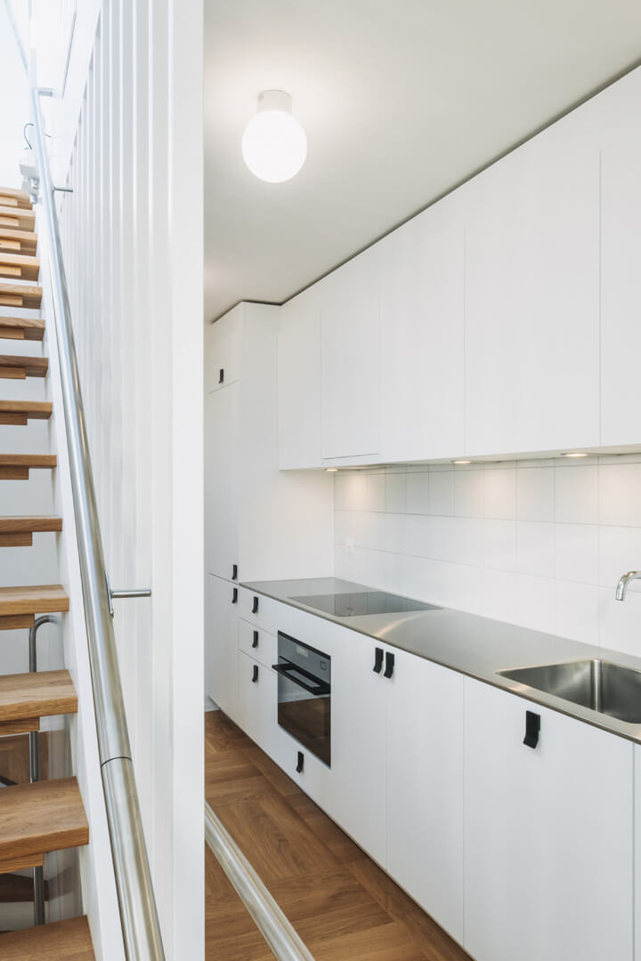 One of the upper floor apartments, featuring stairs to private roof terrace.